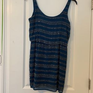 Beautiful beaded teal dress.